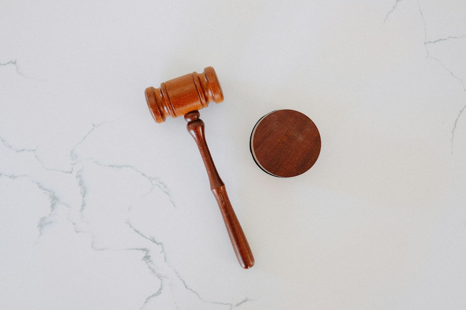 wooden gavel and block on marble
